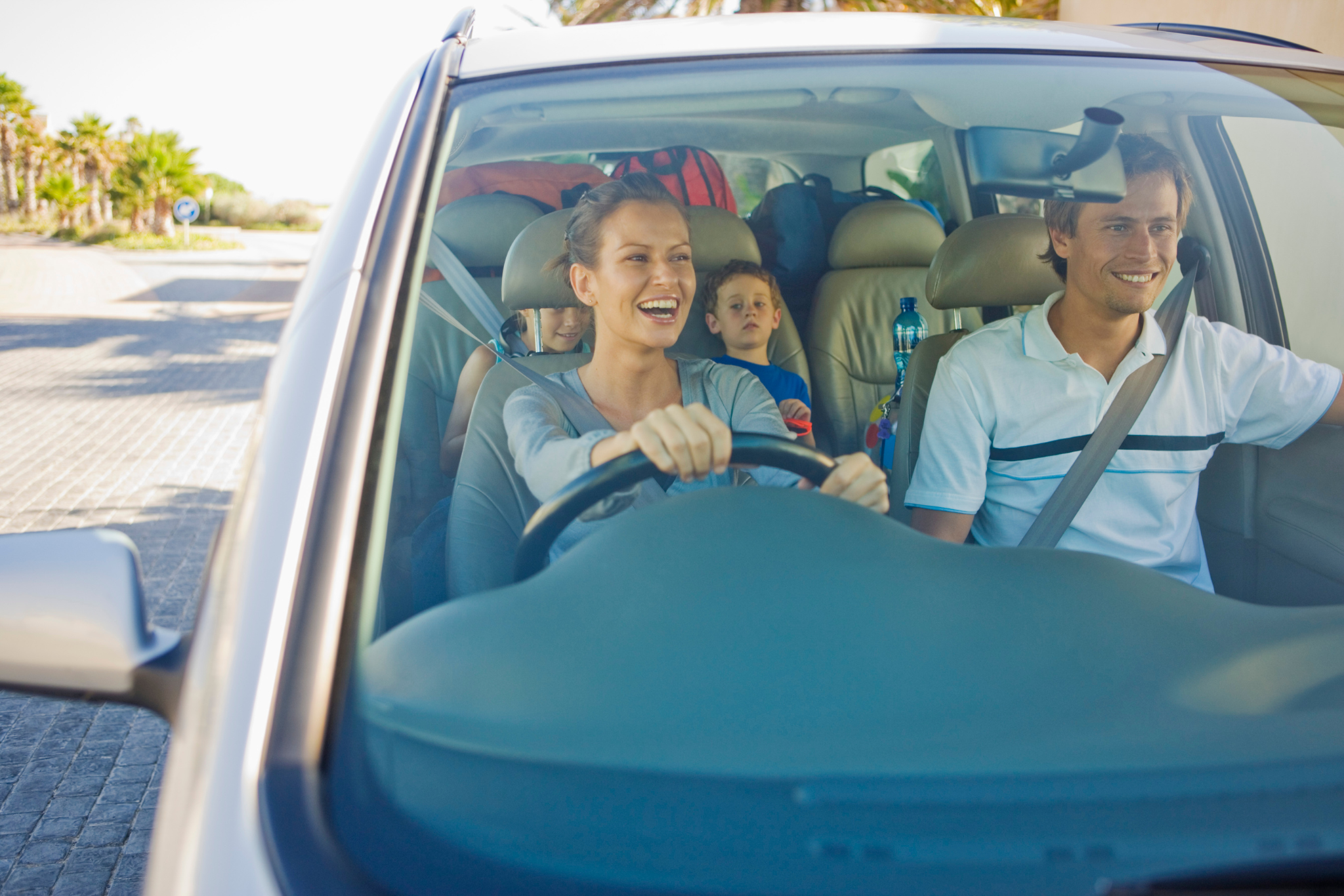 Family inside their new used car from Destin Autos