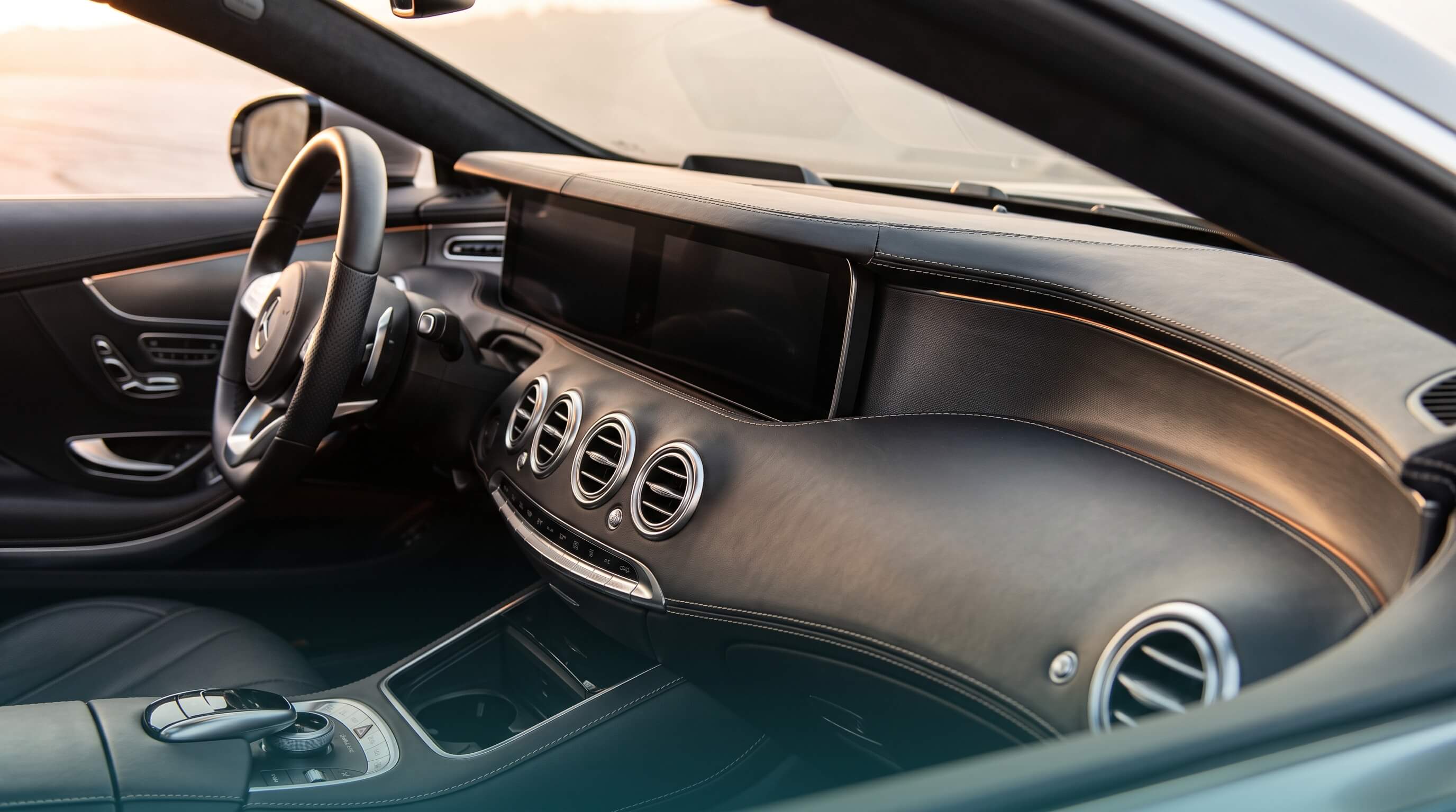 Interior detail of a used Mercedes-Benz showing dashboard and cabin quality
